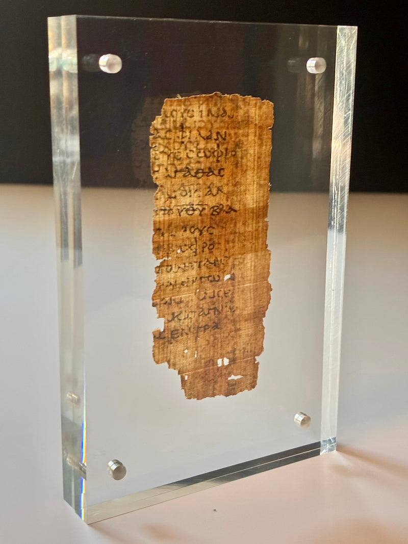 Framed replica of Papyrus 32, Epistle to Titus manuscript fragment